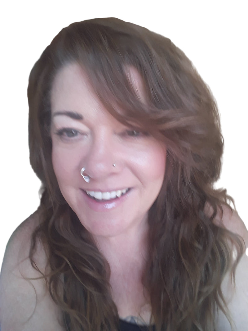 Woman with long brown hair smiling at the camera.