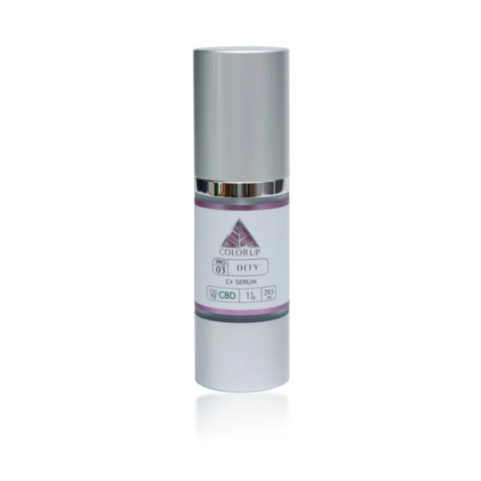 DEFY C+ Serum bottle with 'Color Up' pink logo on silver cosmetic bottle on white background