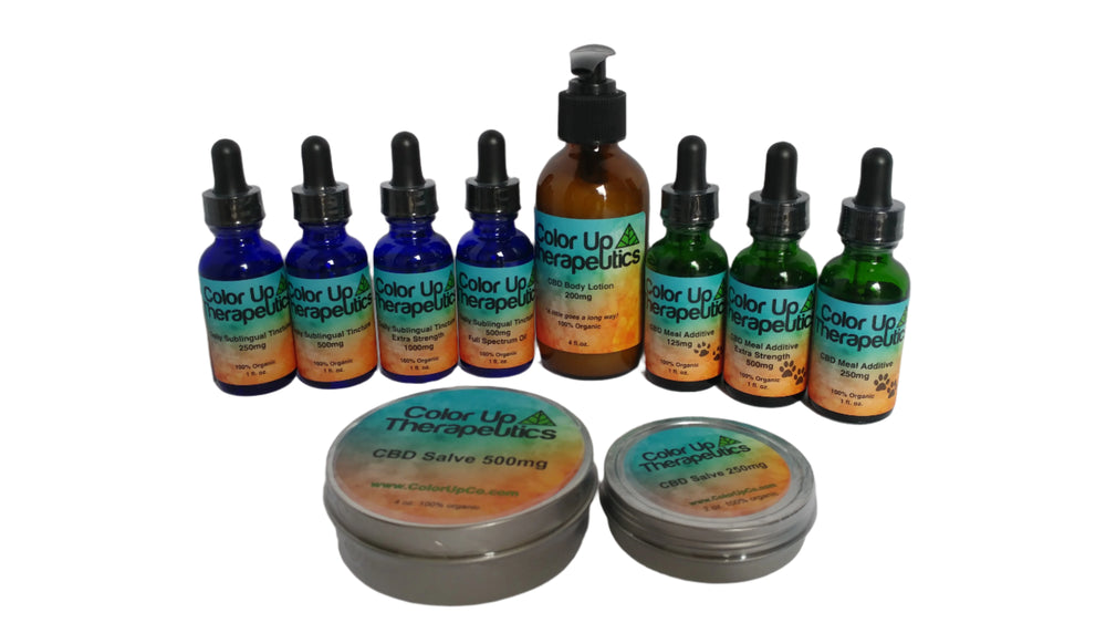 Collection of Color Up Therapeutics products including bottles, tins, and a jar on a white background