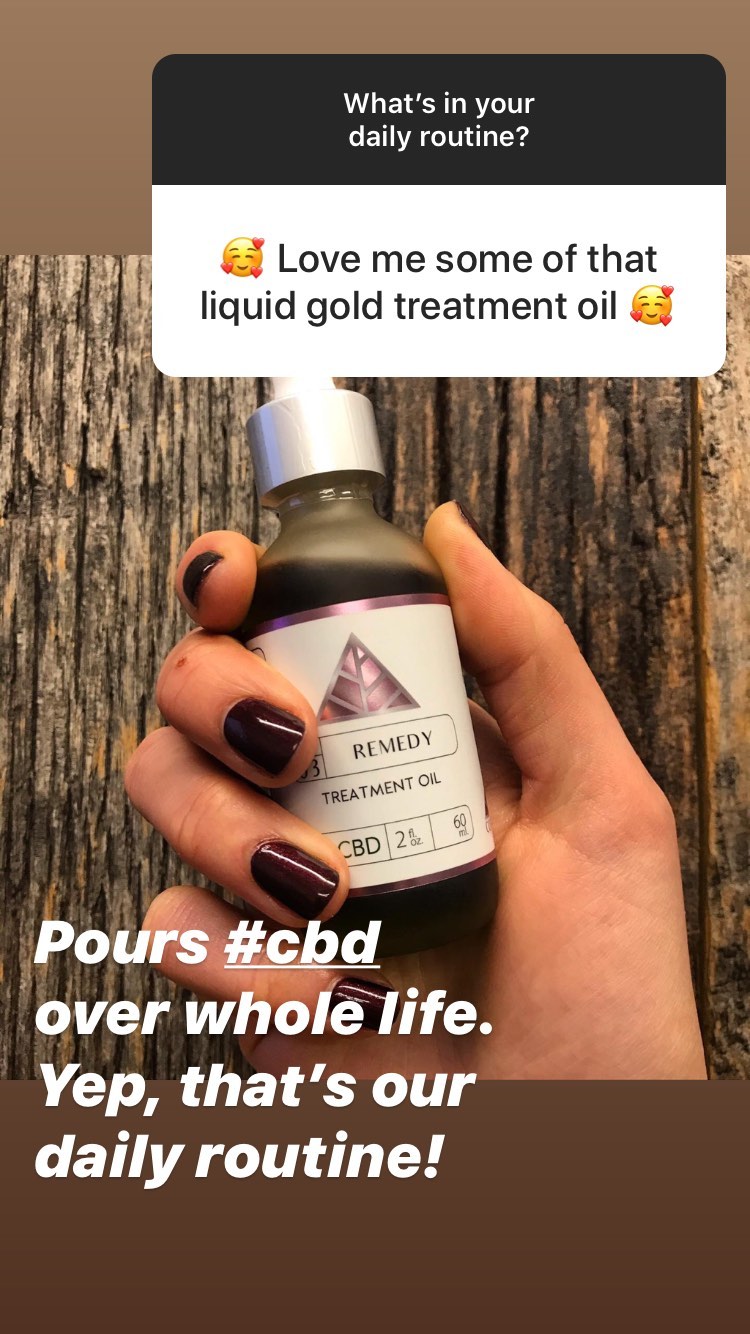 Hand holding a bottle of Remedy CBD Treatment Oil with text overlay on a wooden background