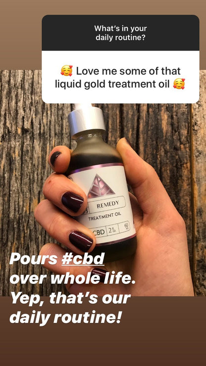 Hand holding a bottle of Remedy CBD Treatment Oil with text overlay on a wooden background