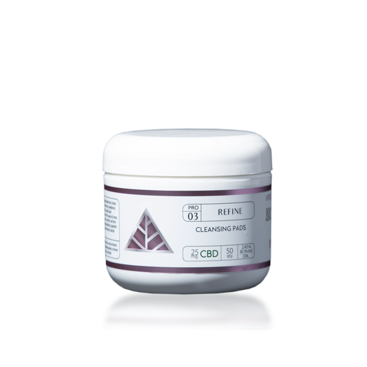 Jar of cleansing pads with a 'Color Up' pink triangle logo on a white background