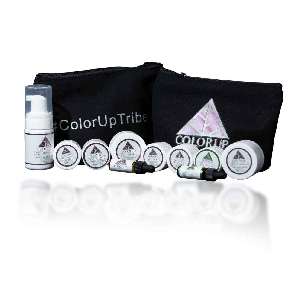 Color Up Tribe blag canvas bag with 10 white sample sized skin care products labeled with Color Up green and pink triangle logos. 
