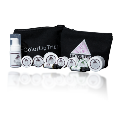 Color Up Tribe blag canvas bag with 10 white sample sized skin care products labeled with Color Up green and pink triangle logos. 