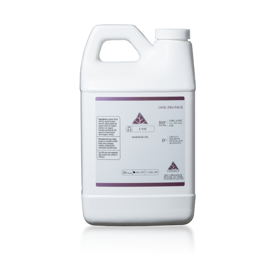 64 ounce white container with handle ad Color Up Ease Massage Oil label with pink details on bottle.