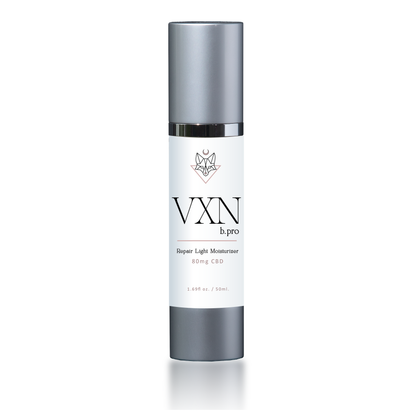 bottle with silver top and white label that says 'repair light vxn wellness'