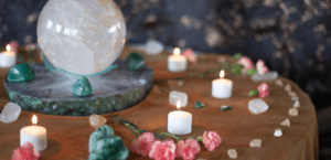 a table with rocks and candles on it